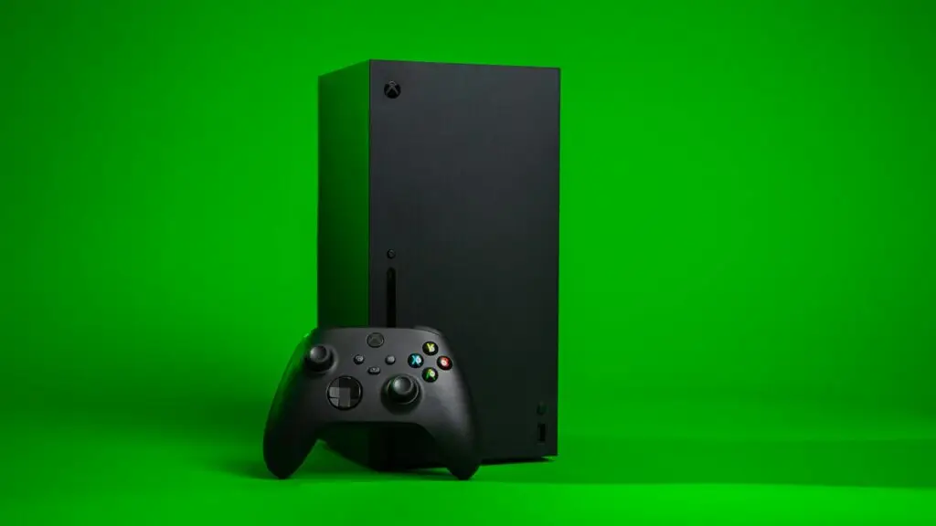 Xbox Series X console with controller on green background